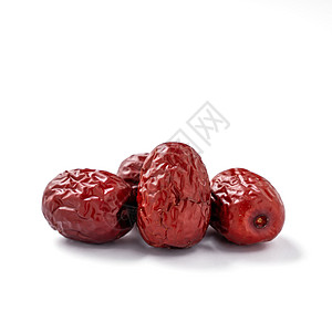 在白色背景中隔离的红色日期 jujube 特写桌子药品植物学小路甜点农业美食酸枣食物草本植物图片