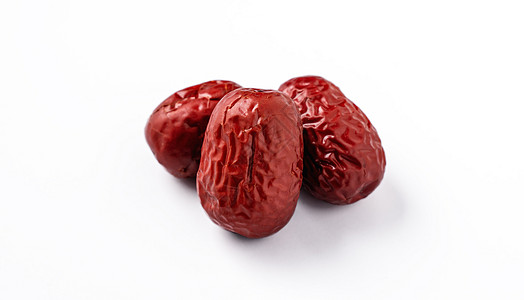 在白色背景中隔离的红色日期 jujube 特写药品酸枣剪裁小路美食甜点食物草本植物植物学桌子图片