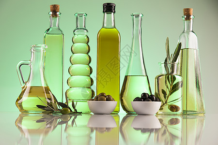 瓶装橄榄油 橄榄枝和煮油橄榄林植物饮食处女绿色玻璃液体农业瓶子水果图片