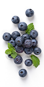 蓝莓水果顶部视角被隔离在白色背景上 平坦地铺设着薄荷叶和健康的设计概念平铺蓝色食物甜点收成团体材料薄荷桌子高架图片