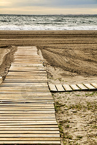 Wooden走在通往西班牙海滩的路上海岸龙头天堂民众热带地平线家具圣波假期足浴图片