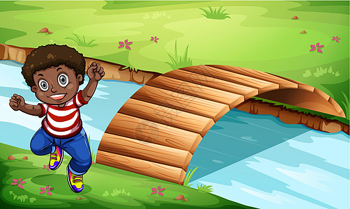 在木桥附近的一个快乐的黑人孩子图片