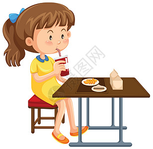 在桌子上吃午饭的女孩图片