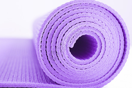 卷起瑜伽或小垫子软垫训练活动工具生活方式橡皮沉思蓝色闲暇锻炼图片