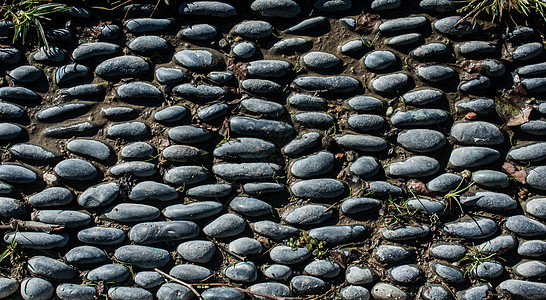 小鹅卵石的背景纹理岩石卵石石头材料路面花岗岩矿物鹅卵石碎石花园图片