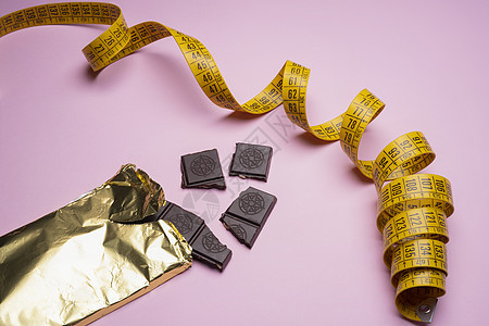 饮食障碍诱惑发胖重量巧克力磁带化合物概念糖果健康仪表图片