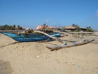 在斯里兰卡海滩上捕鱼的渔船工作假期男人钓鱼天堂帆船罪人运输海洋吸引力图片