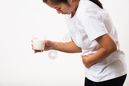 女人用手握着玻璃牛奶 她胃痛得要命过敏症状成人腹部奶制品危险手势药品疼痛疾病图片