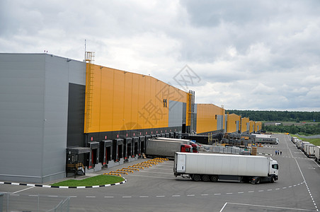 仓库物流中心的工作 卡车开到装货处  是的 长官工厂货车货运货物建筑学贮存办公室建筑运输建造图片