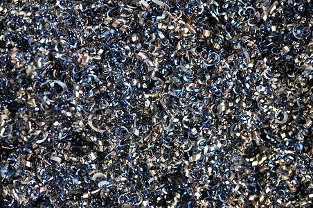 扭曲螺旋钢屑的质地 工业车床蓝色回收金工材料贮存制造业技术生产宏观图片