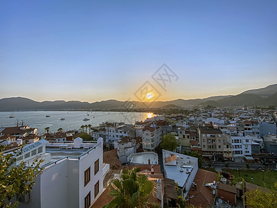 土耳其日落期间的海景     鱼群照片场景风景太阳摄影海滩旅行反射环境全景蓝色图片