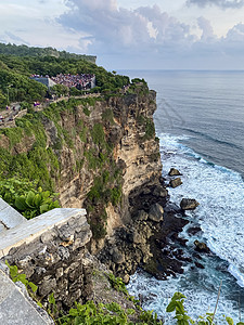 印度尼西亚巴厘岛寺庙的日落  股票照片太阳建筑风景气候岩石蓝色海景假期天空阳光背景图片