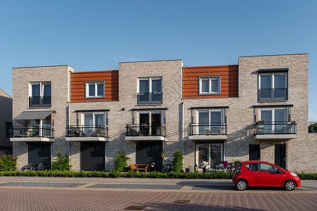 荷兰郊区与现代家庭住宅 在荷兰新建现代家庭住宅 荷兰家庭住宅 公寓天空建筑学花园蓝色房间窗户奢华建筑城市街道图片