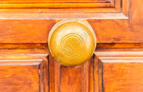 关在圆门把手和装饰品上 门装饰 门装饰艺术圆圈建筑学抛光黄铜建筑风格青铜金子入口图片