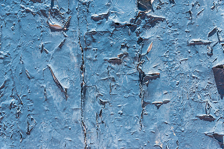旧的片状油漆剥落在旧墙裂缝和表面上的擦伤上古董涂层石膏石头材料水泥染料剥皮建筑衰变图片