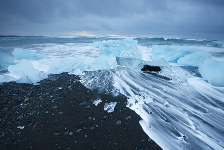 冰山海滩白色天空蓝色海浪火山气候冰川黑色海洋旅行图片