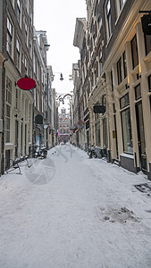 荷兰阿姆斯特丹冬季的雪红色Light区红灯灯区景观建筑学游客街道红灯区城市中心紫色图片