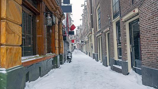 荷兰阿姆斯特丹冬季的雪红色Light区红灯区景观游客文化首都旅行中心风暴自行车目的地图片
