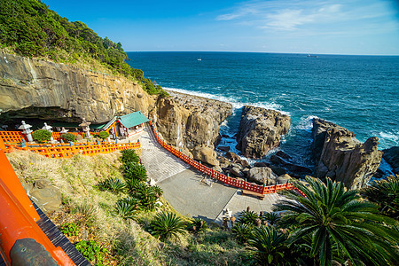 Udo Shrine 位于宫崎市以南的尼希南海岸海浪地标岩石寺庙文化旅行建筑学吸引力红色天空图片