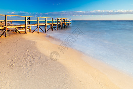 澳洲索雷托市日出时的国王海滩太阳海洋地平线天空海岸旅游旅行码头蓝色海岸线图片