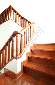 在白色背景上隔离的木制楼梯和扶手木头装饰棕色建筑学上行螺旋风格大厅栏杆建筑图片