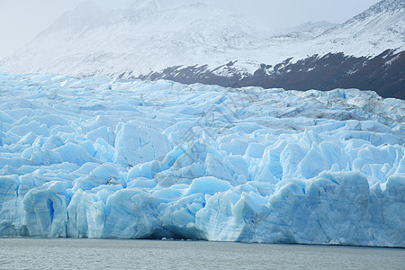 智利巴塔哥尼亚冰川灰色的蓝冰场地蓝色旅行天空山脉旅游公园痛苦冰山国家图片