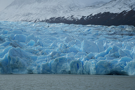智利巴塔哥尼亚冰川灰色的蓝冰冰山旅行蓝色公园痛苦旅游山脉国家天空场地图片