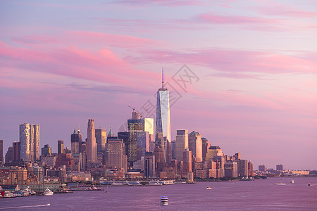 日落时 下城曼哈顿天际办公室地标商业建筑学景观码头港口摩天大楼旅行风景图片