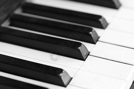 钢琴键和木质谷物乐器键盘音乐会艺术黑色象牙音乐白色古董木头图片