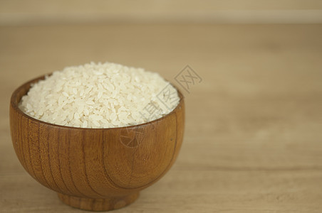 白饭一碗放在木桌上白色谷物文化营养粮食美食木头种子午餐食物图片