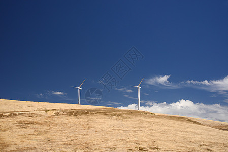 风力涡轮机爬坡力量金子生产涡轮环境风车蓝色天空黄色图片
