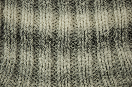 它是针织质地或背景地毯纤维工艺手工针织品桌布条纹羊毛材料纺织品图片