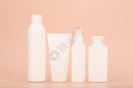 白色无品牌化妆品瓶 排成一行 背着糊盘蜜蜂背景生物瓶子卫生身体产品化妆品奶油商品浴室生态图片