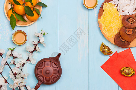 概念平坦的中国新年食物和饮用静水生命 文字出现在图中 繁荣 春天和好运椰子糖果西瓜月球水果种子红包小吃红色家庭图片