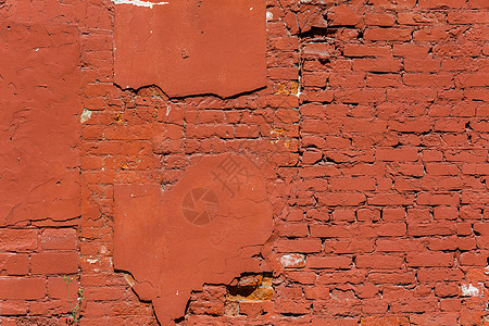 旧砖墙 石膏剥落 覆盖着彩绘的红毛猩猩材料橙子建筑墙纸石头街道风化画幅建筑学阳光图片