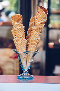 圆玻璃食品市场上的空冰淇淋甜点锥体销售短号蛋糕食物奶油店铺糕点小吃杯子背景