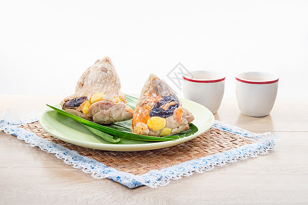 稻子或带茶的宗济点心坚果猪肉饺子节日午餐粽子细绳叶子杯子图片