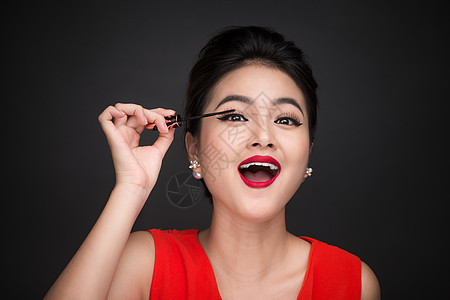 化妆品和化妆品概念 亚洲女性做化妆师的眼睫毛黑面纱刷子女士黑色皮肤眼睛女孩图片