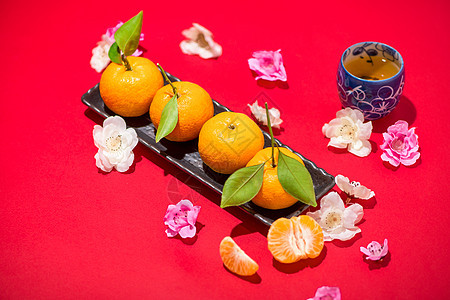 中国新年装饰品 红背景的普通橘子文化运气杯子庆典传统月球节日橙子桌子财富图片