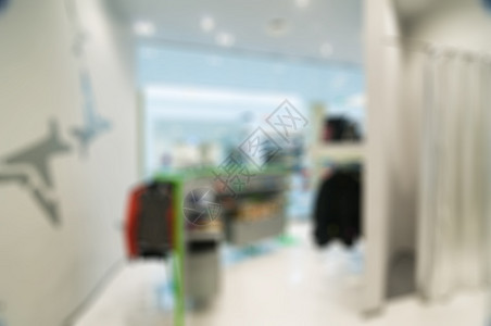 购物商场主题的模糊背景精品白色中心商业销售部门衣服产品店铺房间图片