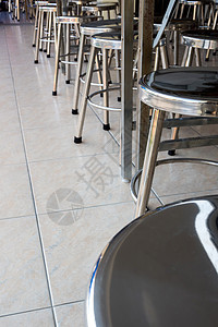 学校食堂的不锈钢凳椅子座位凳子咖啡店家具餐厅背景图片