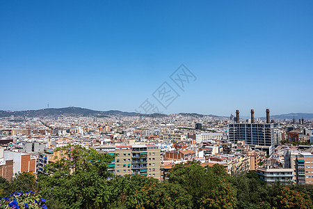 从蒙特朱奇山在巴塞罗那上空的景象房屋目的地大教堂游客蓝天旅行观光地标地方景观图片