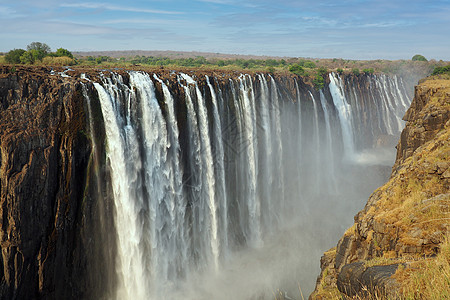 津巴布韦与赞比亚之间的赞比西河上的维多利亚瀑布公园流动岩石旅游风景天线彩虹溪流峡谷急流图片