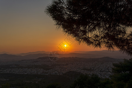 雅典的日落全景观 来自希腊的希臘美特斯山树木天际阳光建筑城市旅行天空爬坡橙子旅游图片