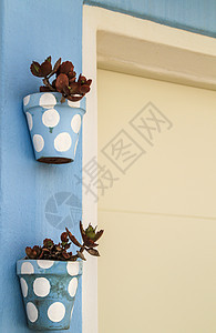 西班牙阿尔梅里亚典型的安达卢西亚白洗脸面蓝色建筑晴天建筑学假期别墅社区街道窗户房子图片