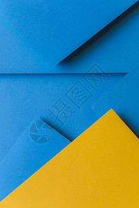 创意安排黄色蓝色彩色纸创建抽象背景 高品质美丽的照片概念图片