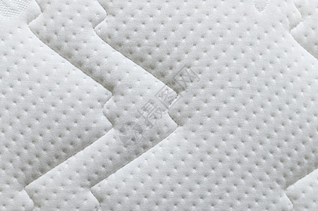 特写白色床垫纹理背景 材料和家具概念 舒适软沙发床上用具图片