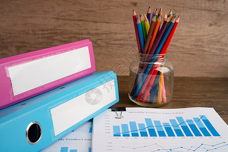 Binder数据财务报告业务和彩色铅笔以及办公室的图表分析图片