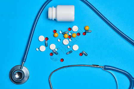 化学抗生素药物药品注射器蓝色背景药店科学止痛药治疗帮助药剂红色胶囊疼痛疾病图片
