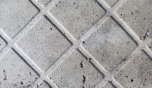 旧的黑暗破旧和划伤的灰色混凝土地板的背景 有地砖的痕迹 混凝土质地 深灰色瓷砖脱落痕迹 网状结构 混凝土块石头水泥古董建筑风化材图片